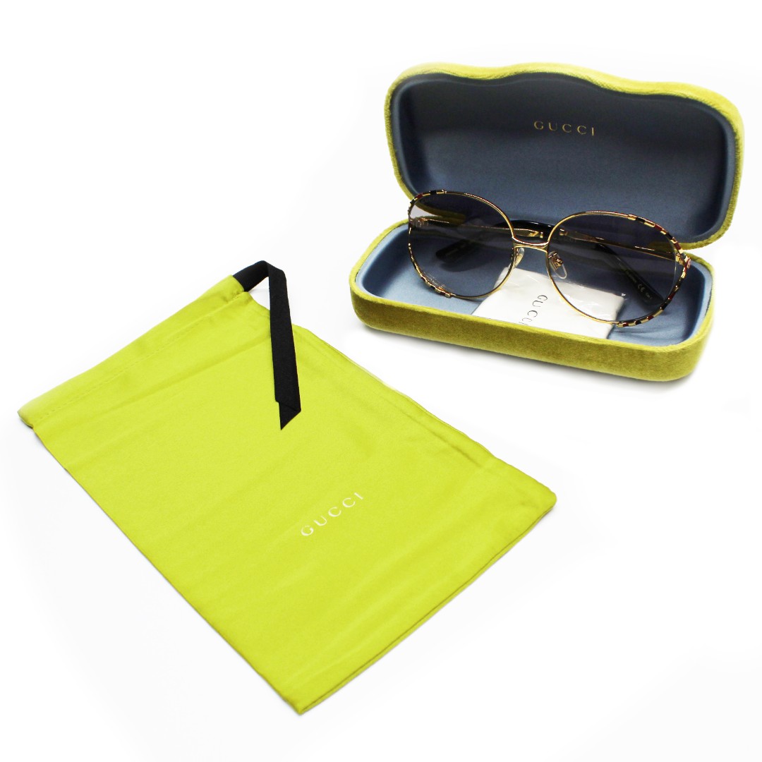 Солнцезащитные очки Gucci GG0595S золотистые